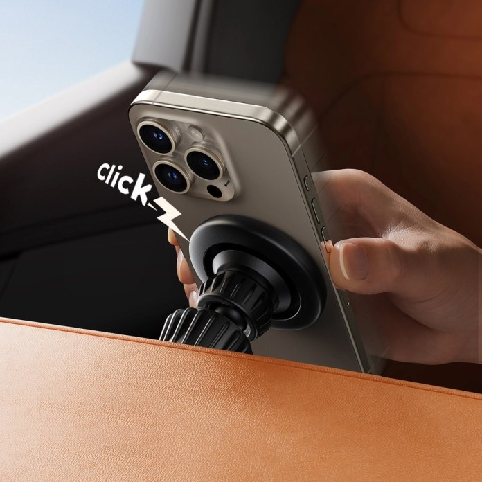 Osoba wkłada telefon na Uchwyt Joyroom JR-ZS406